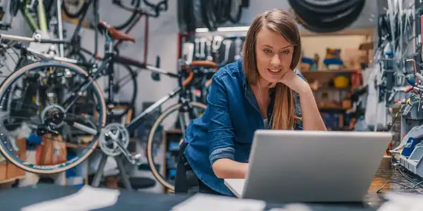 ebike mechanic in the shop looking up parts
